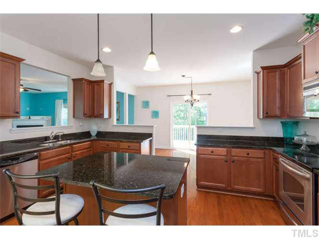 1413 Pattersons Mill Road Durham, NC 27703 - Photo 8 of 25 Kitchen is a bright and open space with plenty of room to cook up your favorite meals. Kitchen
