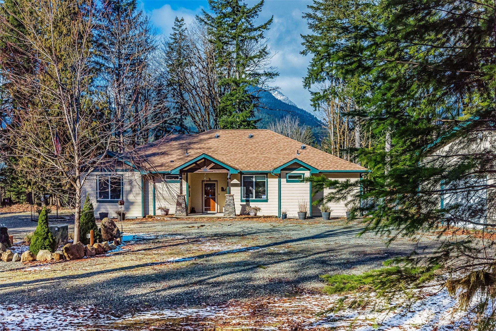 a front view of a house with a garden