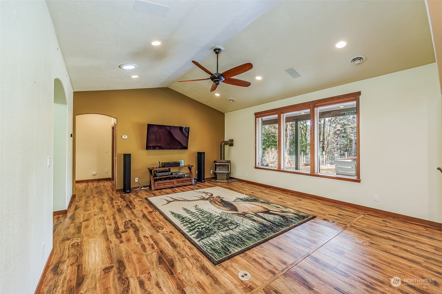 119 Marmot Loop Packwood, WA 98361 - Photo 11 of 40 a living room with couch rug and a flat screen tv