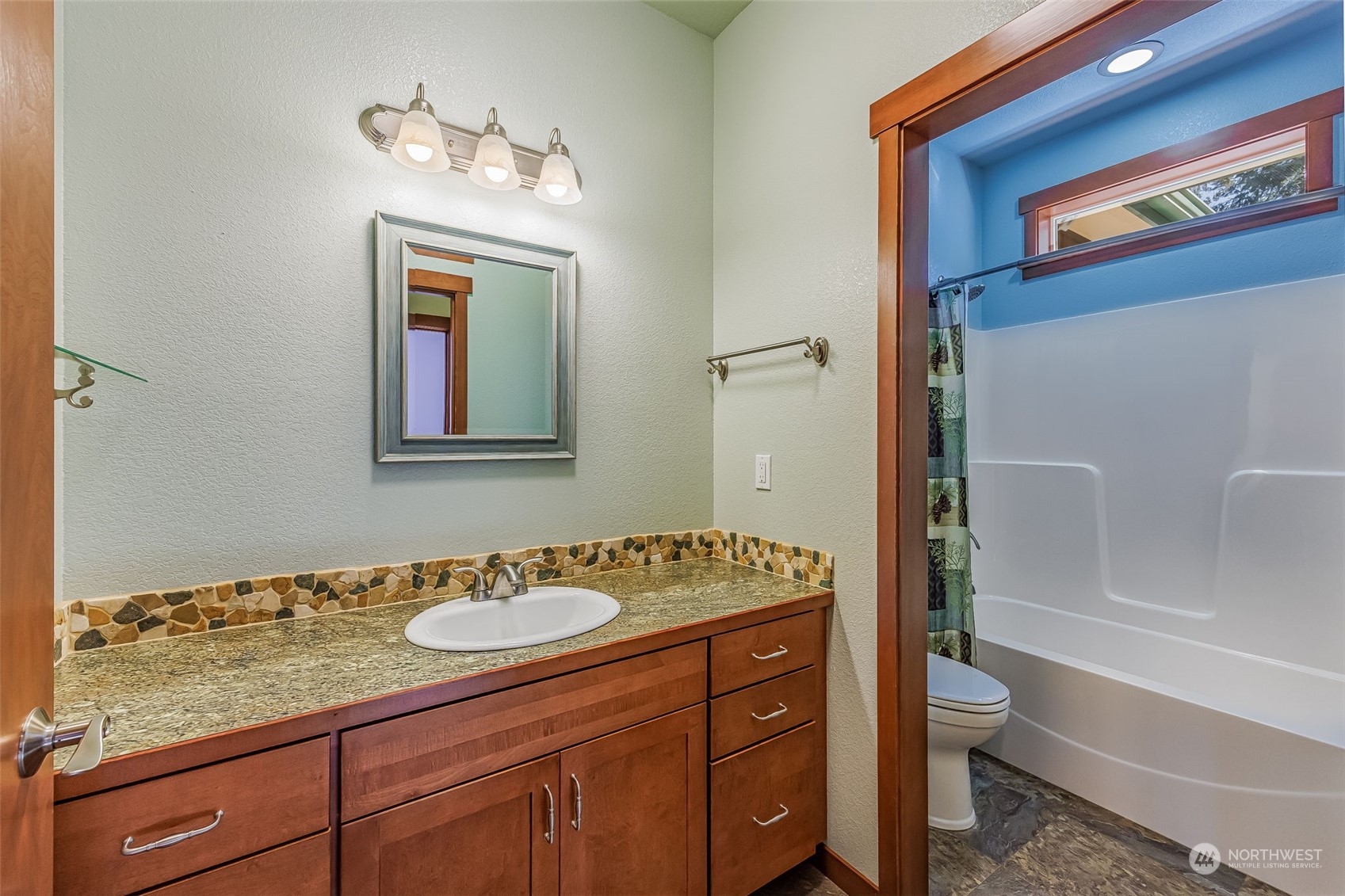 119 Marmot Loop Packwood, WA 98361 - Photo 27 of 40 a bathroom with a granite countertop sink toilet and shower