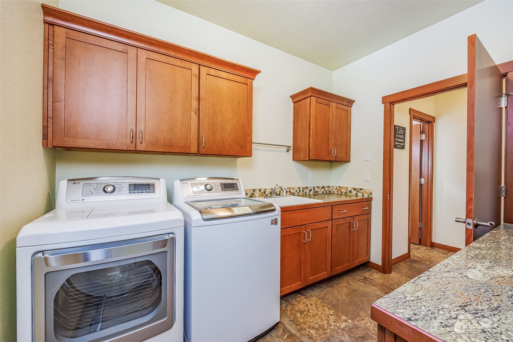 119 Marmot Loop Packwood, WA 98361 - Photo 28 of 40 a kitchen with stainless steel appliances granite countertop a stove a sink and a refrigerator
