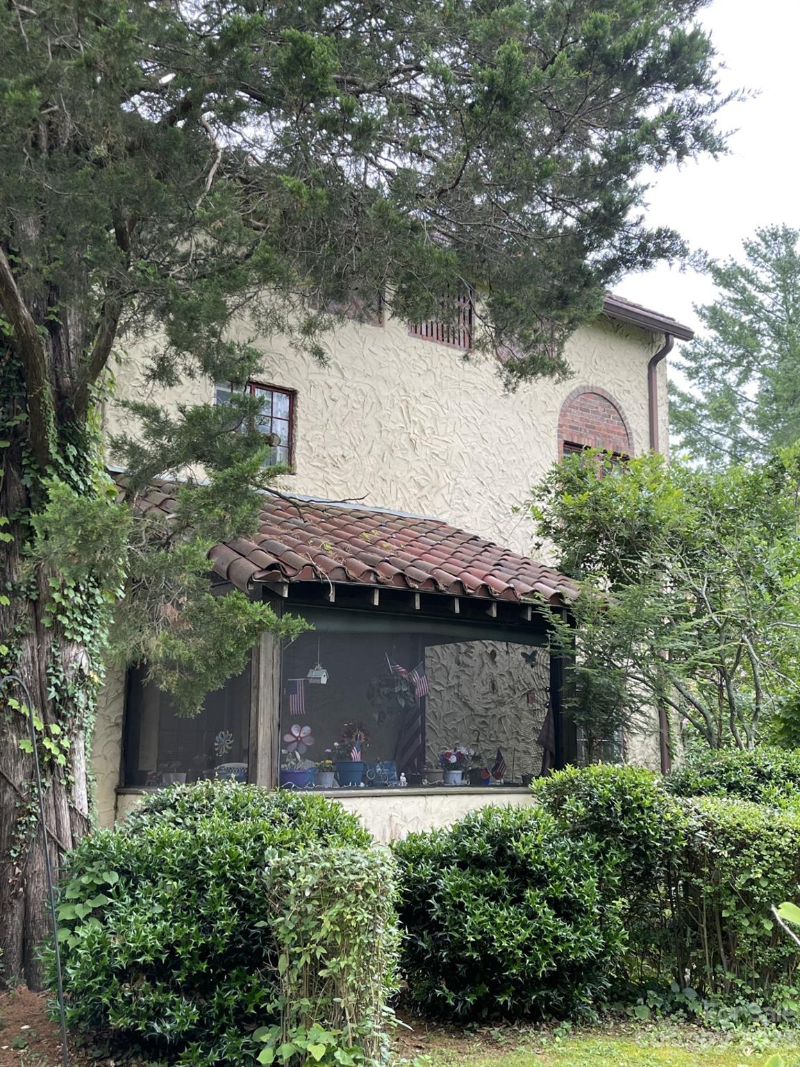 85 Melrose Avenue Tryon, NC 28782 - Photo 12 of 22 an aerial view of a house with a yard and large tree