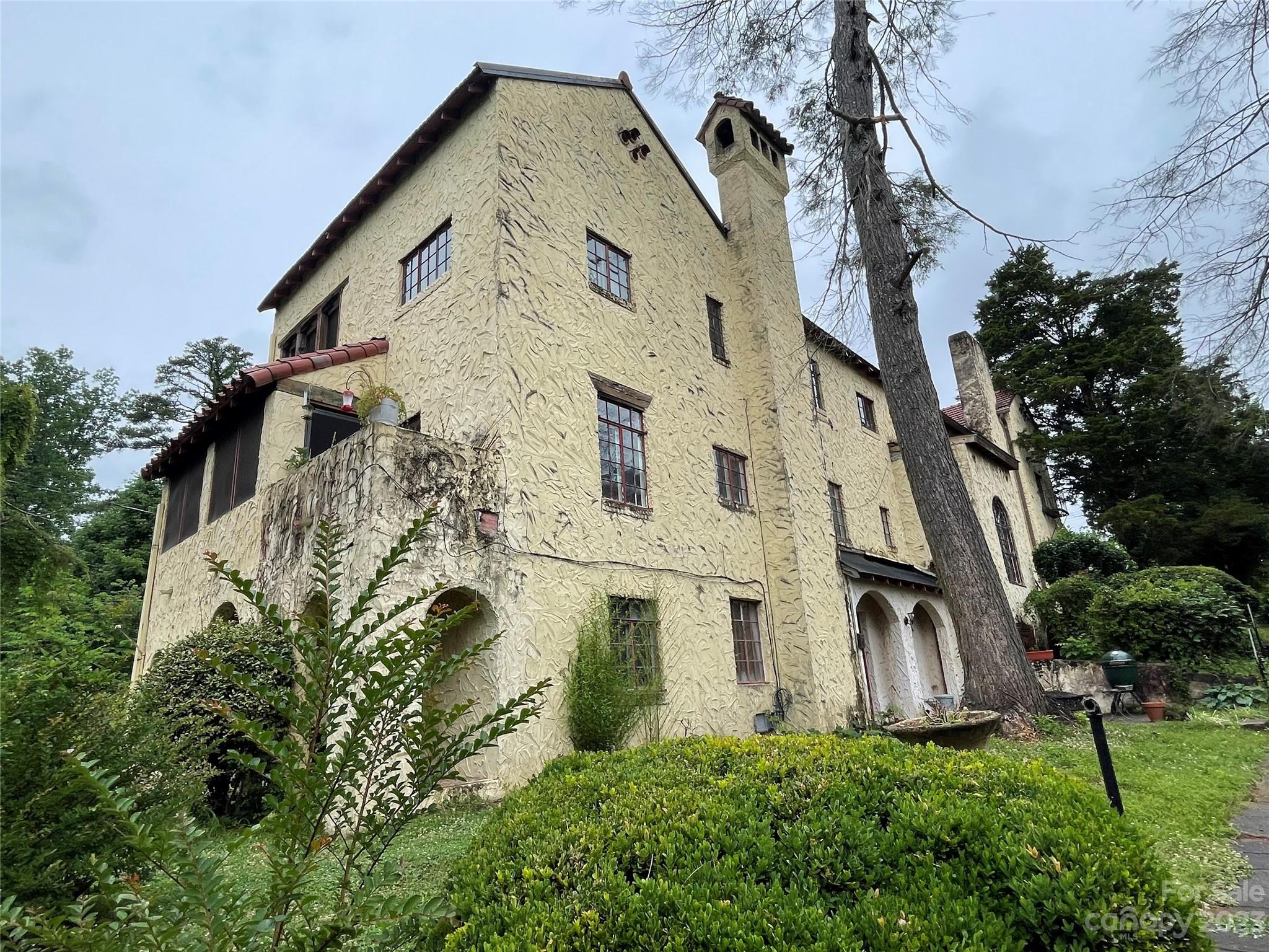 85 Melrose Avenue Tryon, NC 28782 - Photo 13 of 22 a view of a white house with a yard