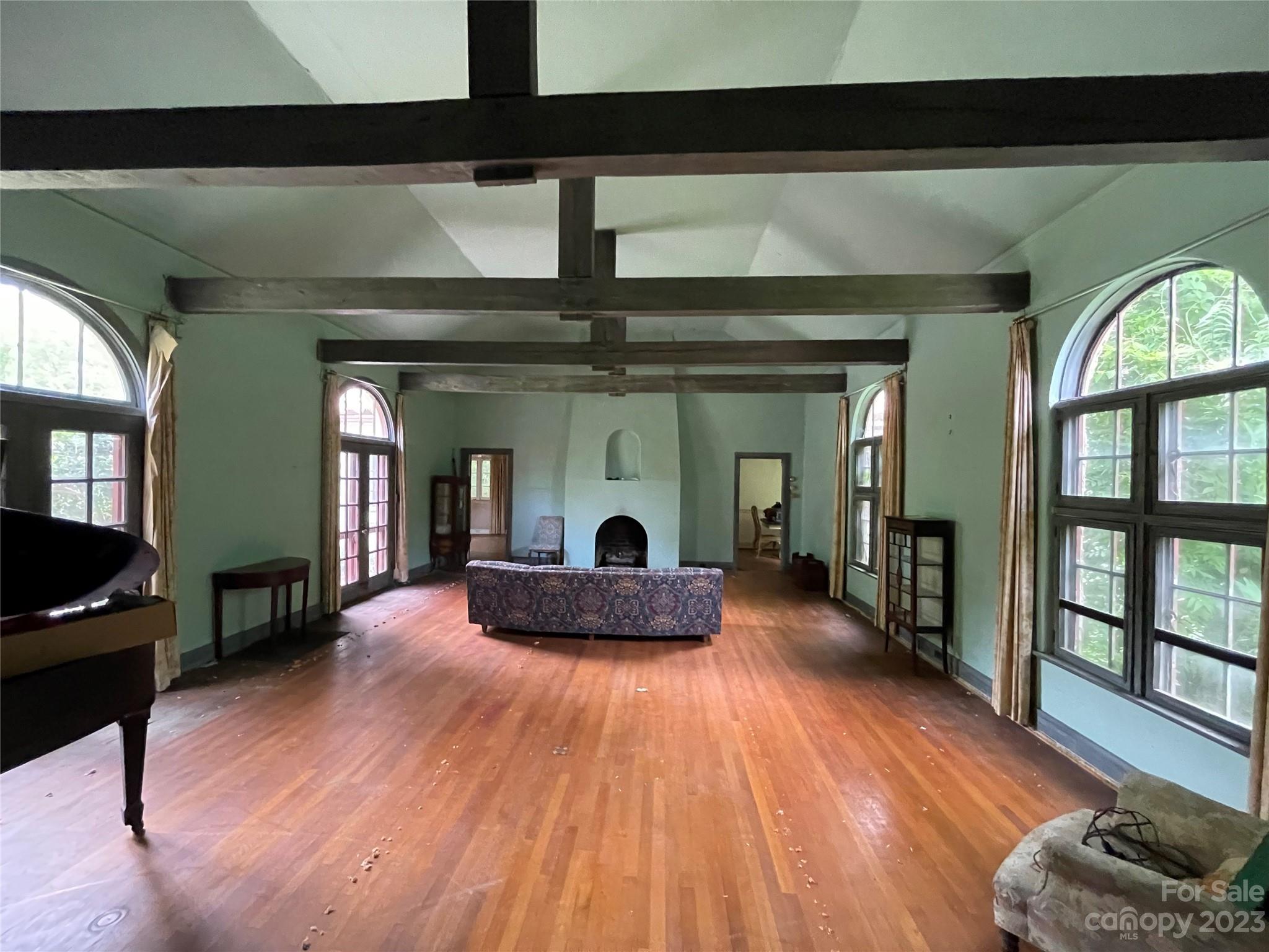 85 Melrose Avenue Tryon, NC 28782 - Photo 5 of 22 a living room with furniture and a fireplace