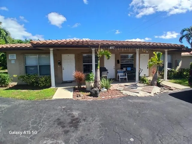 a view of a house with outdoor space and windows
