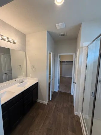 a bathroom with a glass door