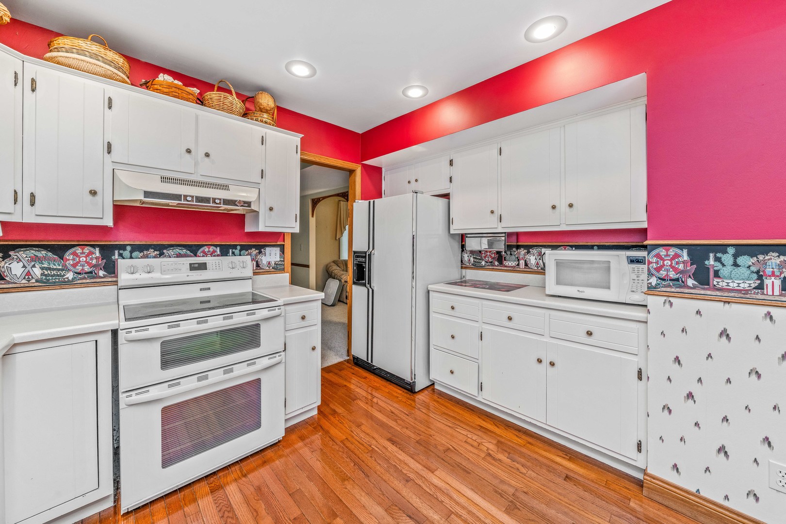2012 North 3650th Road Serena, IL 60549 - Photo 30 of 55 a kitchen with granite countertop a white stove top oven and cabinets