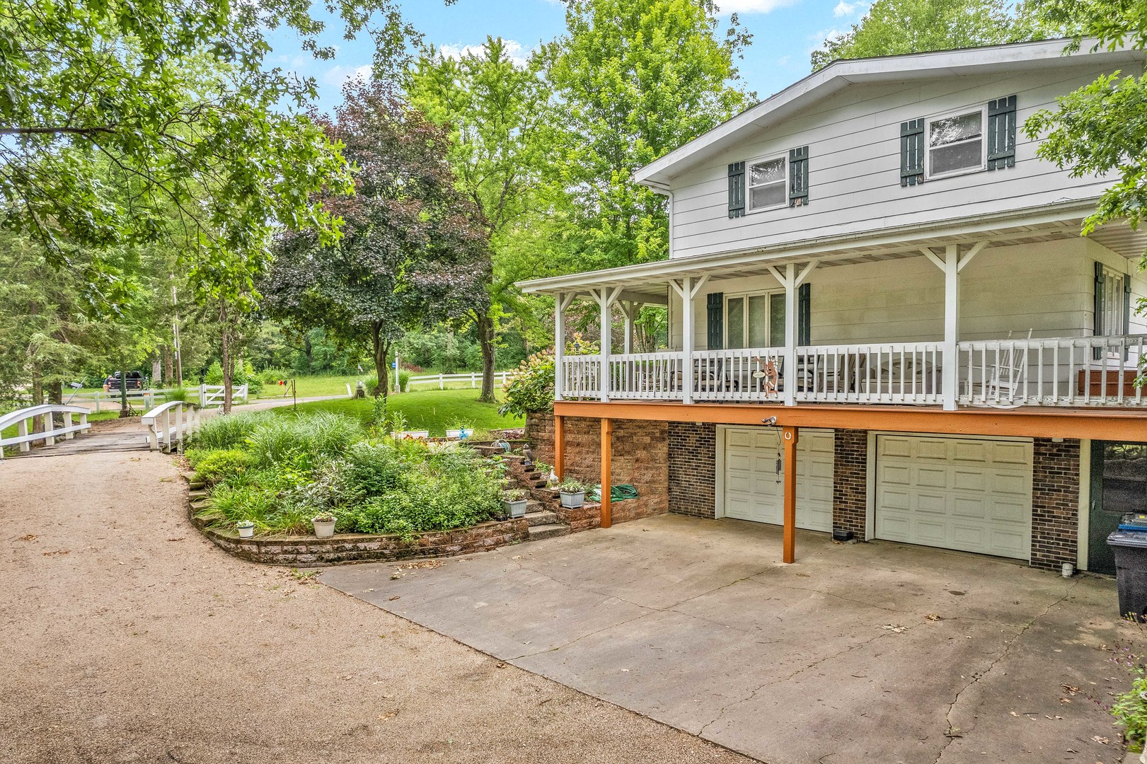 2012 North 3650th Road Serena, IL 60549 - Photo 41 of 55 a front view of a house with a garden and plants