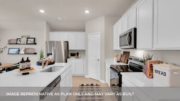 a dining room with furniture a window and a chandelier