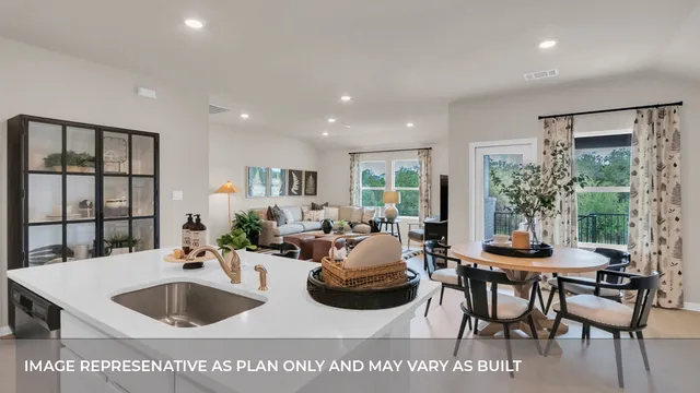 a kitchen with stainless steel appliances kitchen island granite countertop a stove a sink a dining table and chairs