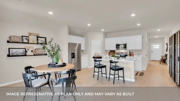 a living room with furniture a lamp and a large window