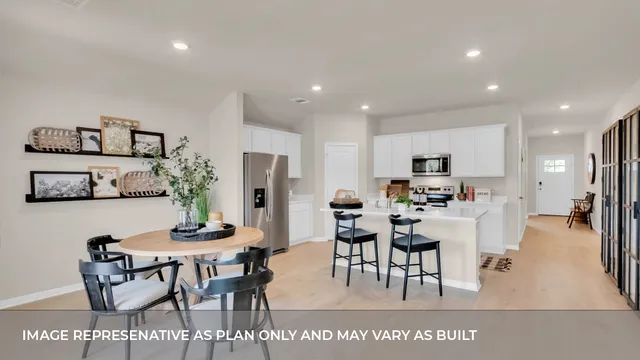 a living room with furniture a lamp and a large window