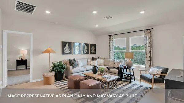 a living room with furniture and large window