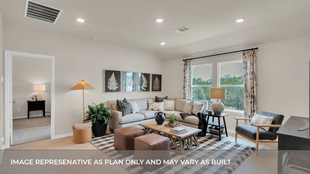 a living room with furniture and large window
