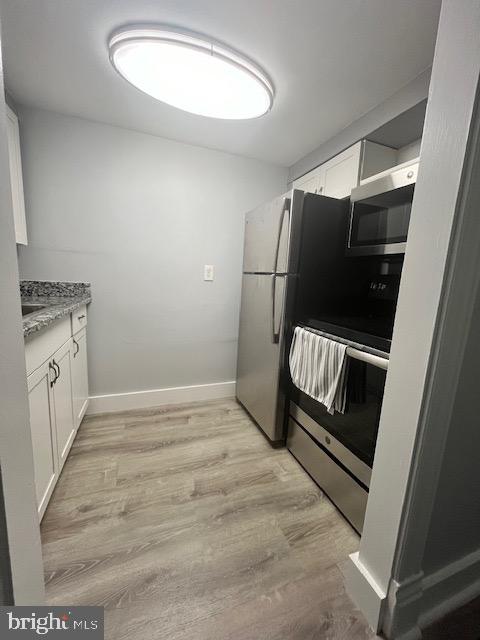 547 4th Street Southeast Washington, DC 20003 - Photo 10 of 12 a view of a hallway with washer and dryer