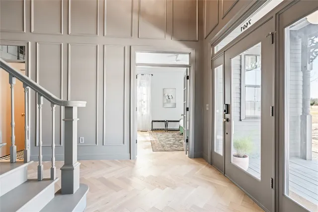 a bedroom with double bed and a flat tv screen