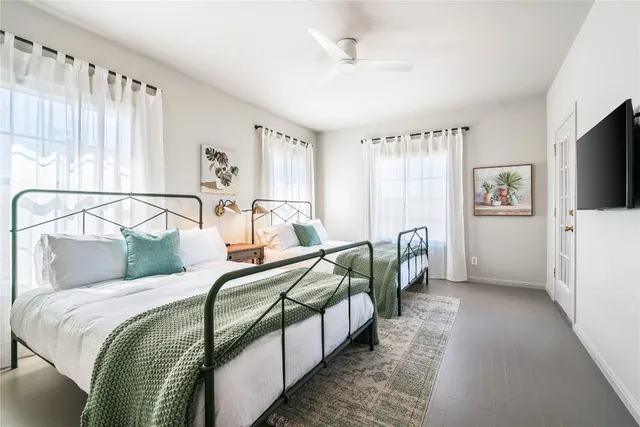 a living room with a couch and a bookshelf