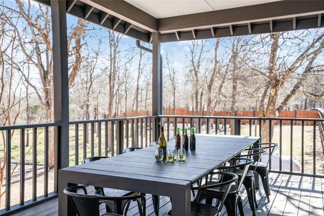 a view of a house with a patio and a yard