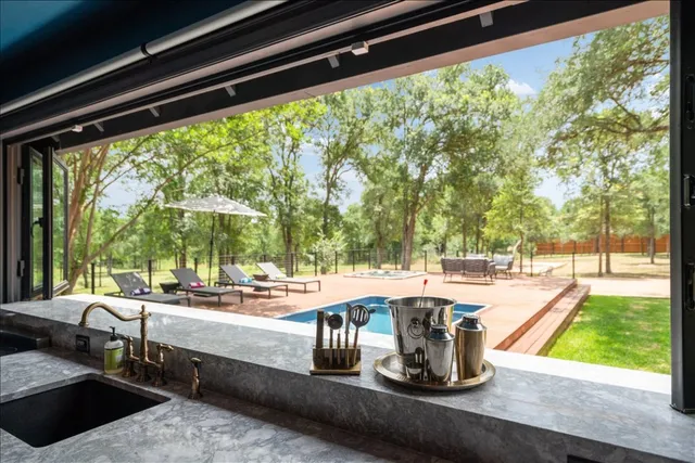 an aerial view of a house with a yard and garden