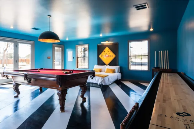 an aerial view of a residential houses with yard