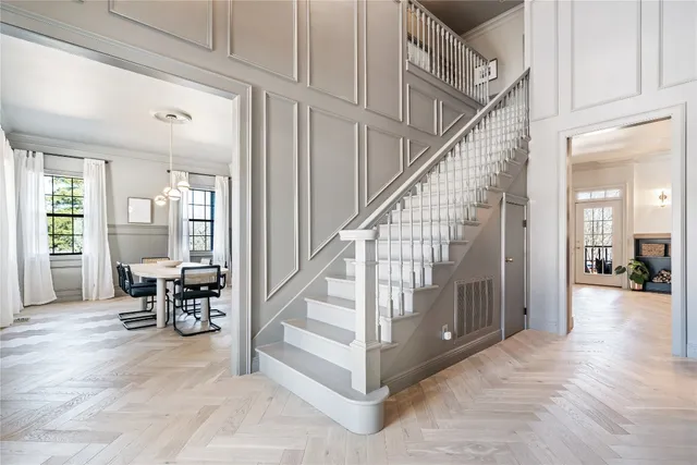 a kitchen with a dining table cabinets and stainless steel appliances