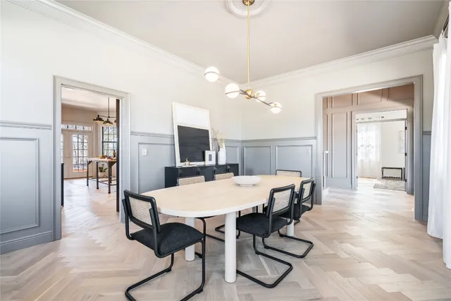 a view of a bedroom with furniture and windows