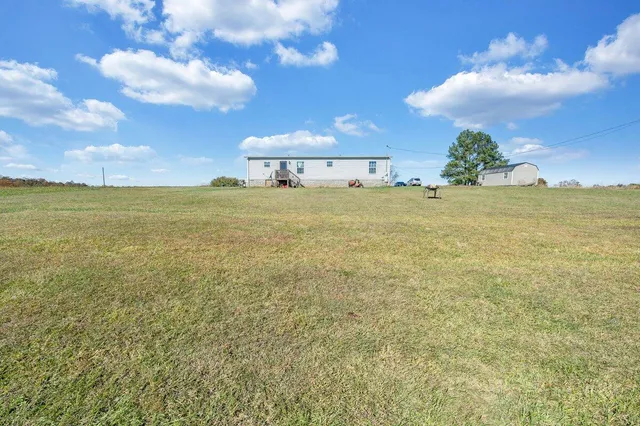 a view of a big room with table and chair