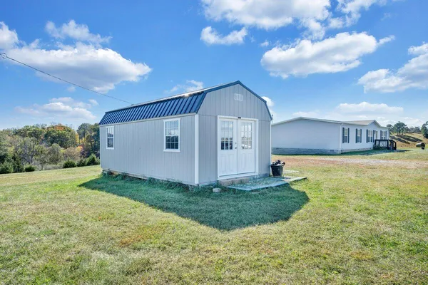 a view of a back yard of the house