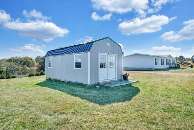 a view of a back yard of the house