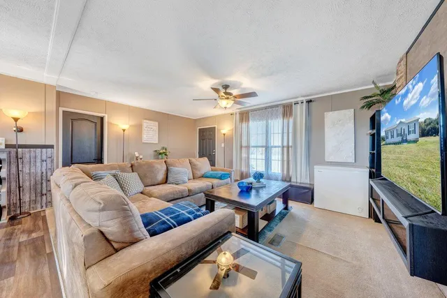 a living room with furniture and a large window