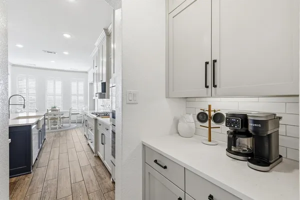 a kitchen with sink cabinets and appliances