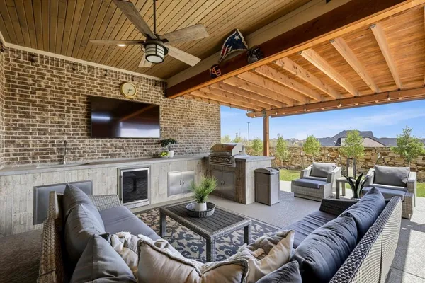 a living room with furniture a fireplace and a table