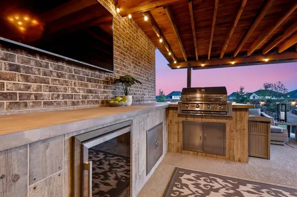 a view of a terrace with couches and sky view