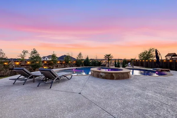 a view of a backyard with flower plants