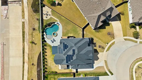 an aerial view of a house with swimming pool