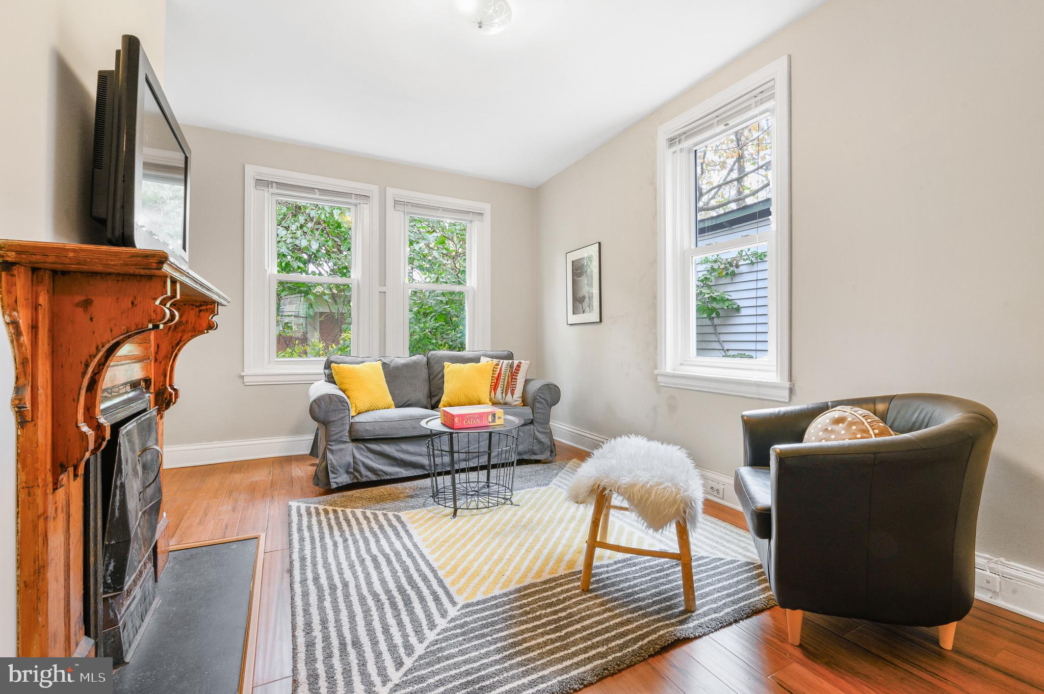 4248 Regent Square Philadelphia, PA 19104 - Photo 18 of 32 a living room with furniture a window and a flat screen tv