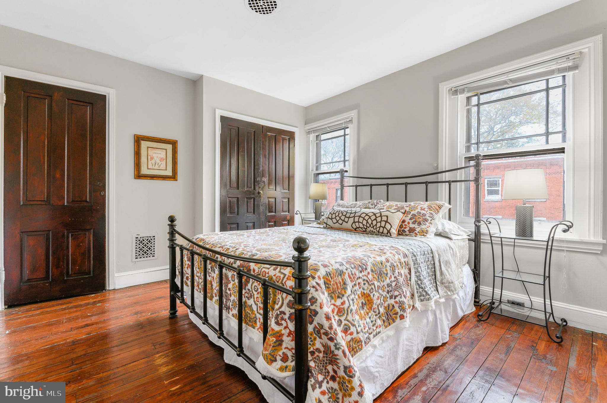 4248 Regent Square Philadelphia, PA 19104 - Photo 22 of 32 a bed sitting in a bedroom next to a window