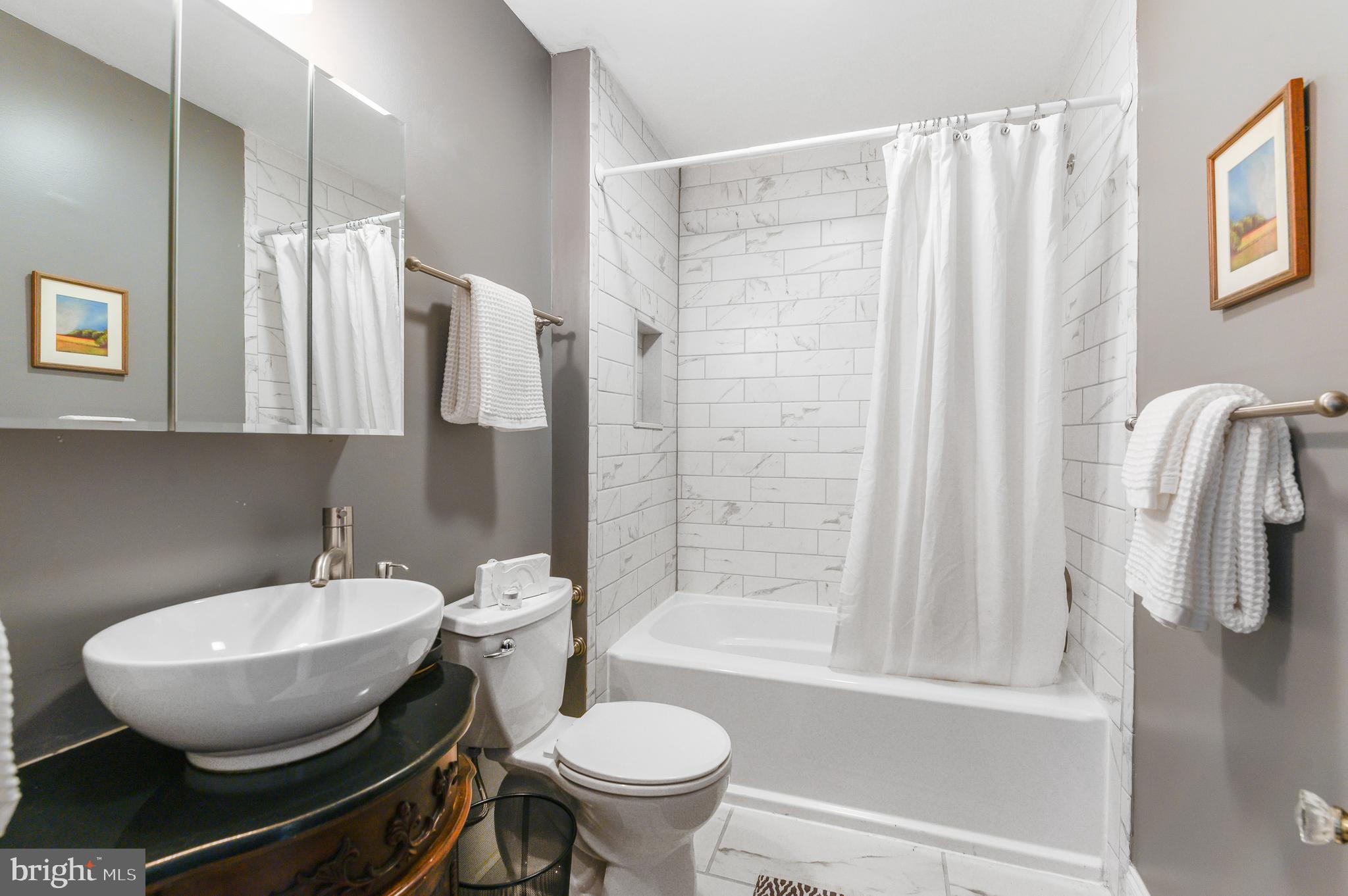 4248 Regent Square Philadelphia, PA 19104 - Photo 23 of 32 a bathroom with a toilet and a sink