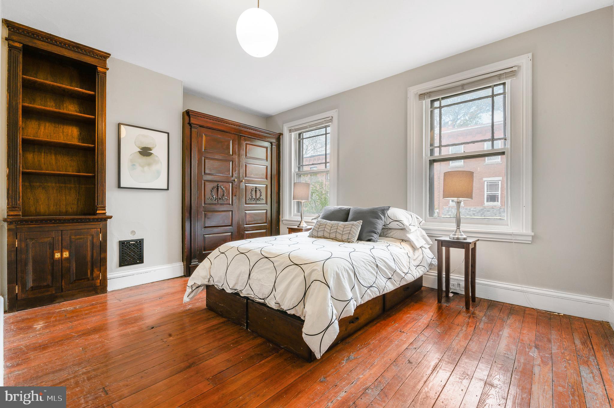 4248 Regent Square Philadelphia, PA 19104 - Photo 24 of 32 a bedroom with a bed and wooden floor