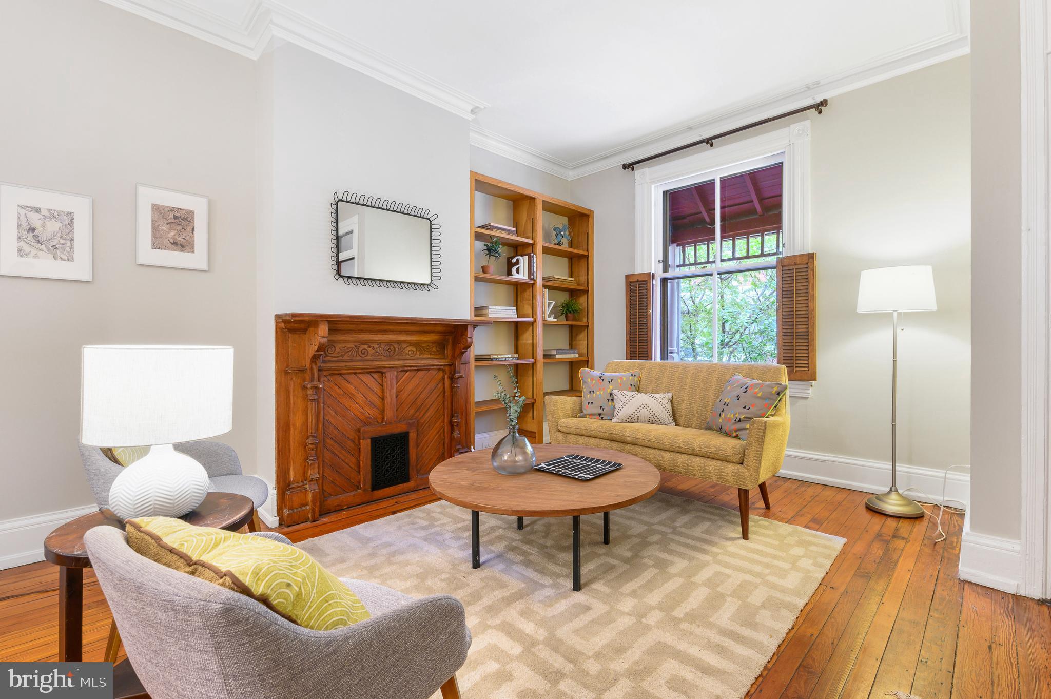 4248 Regent Square Philadelphia, PA 19104 - Photo 4 of 32 a living room with furniture and a fireplace
