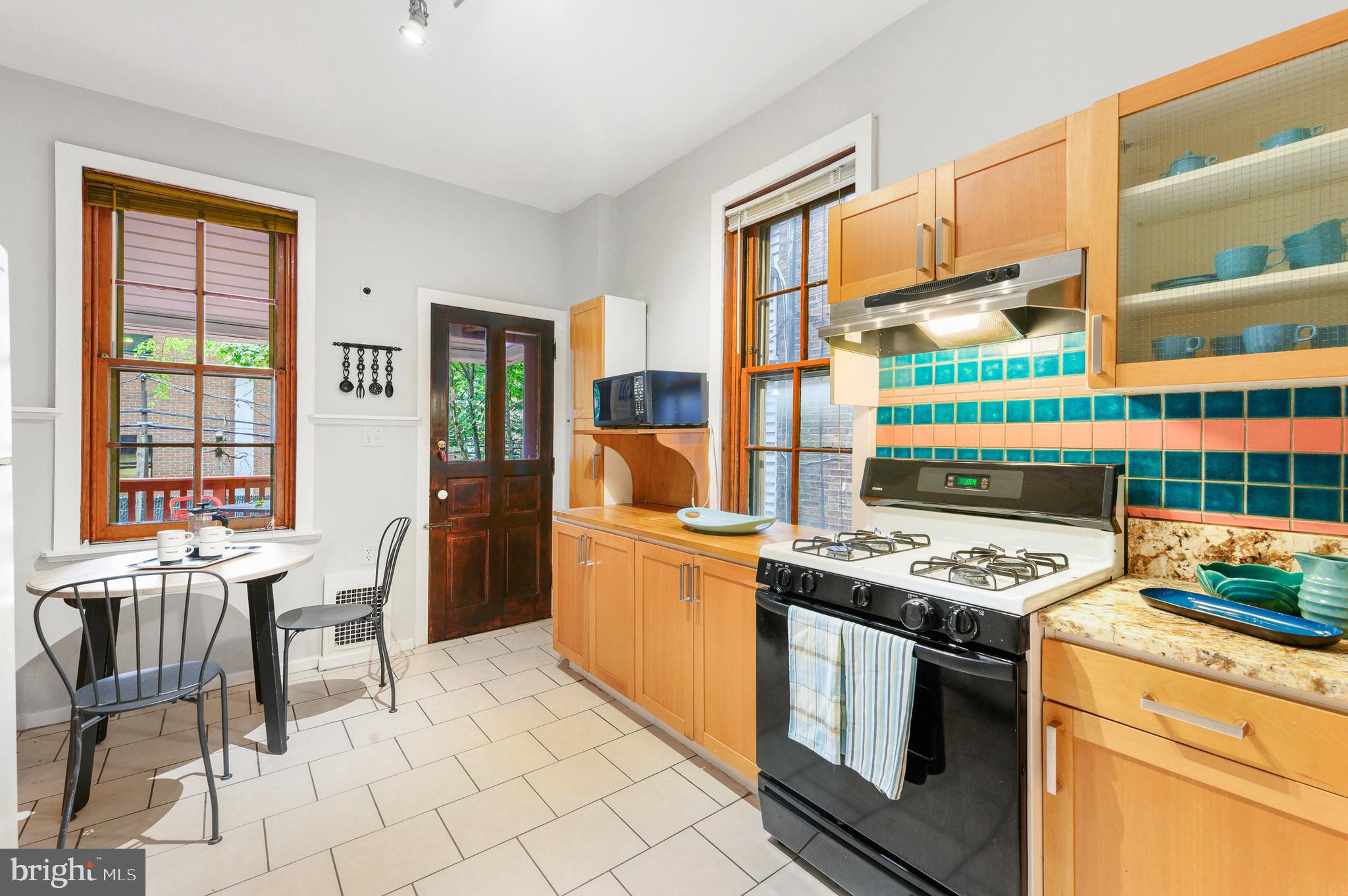4248 Regent Square Philadelphia, PA 19104 - Photo 8 of 32 a kitchen with a stove a sink and a refrigerator