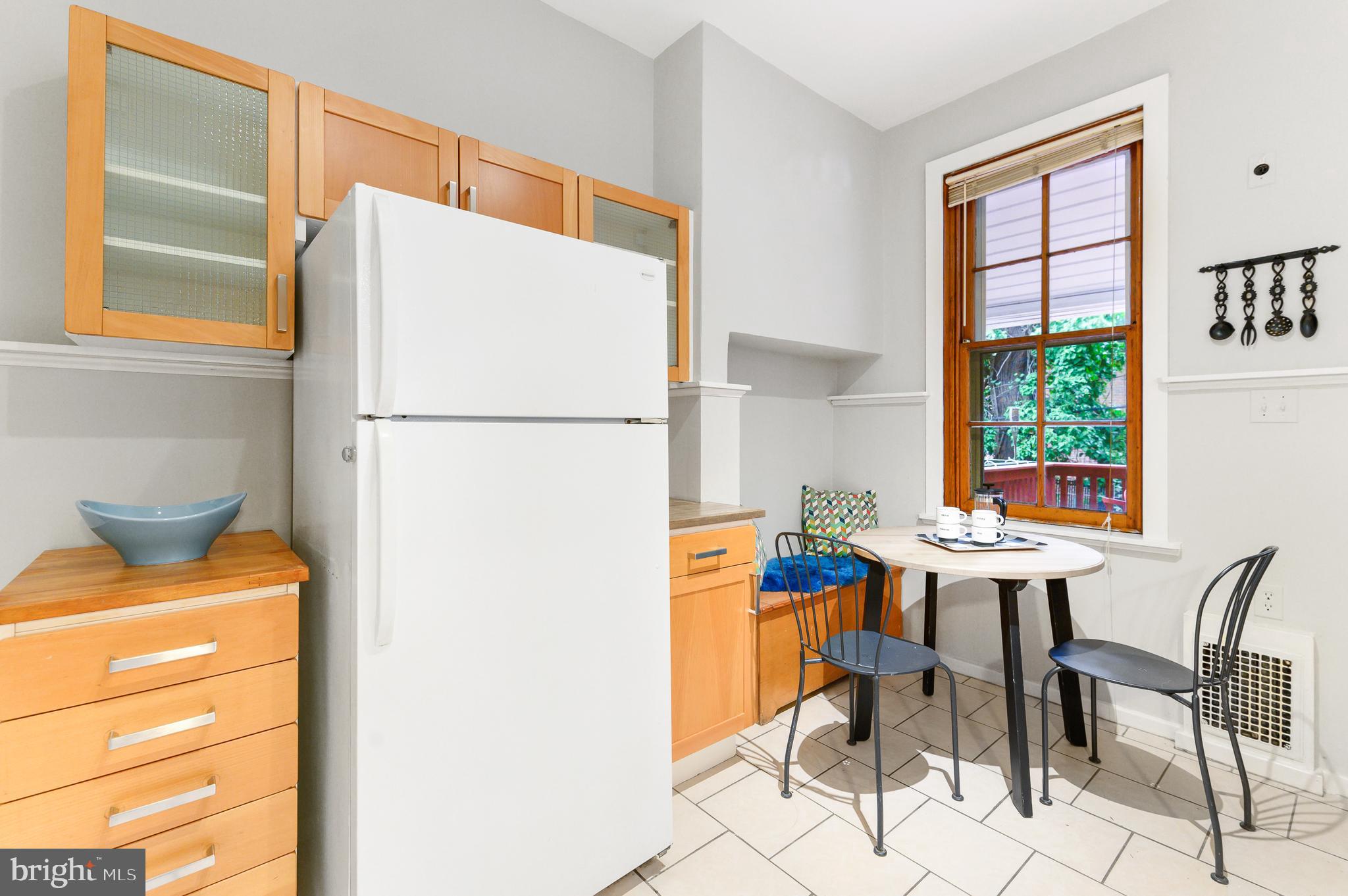 4248 Regent Square Philadelphia, PA 19104 - Photo 10 of 32 a view of a dining room with furniture and a window