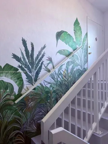 a view of balcony with a potted plant