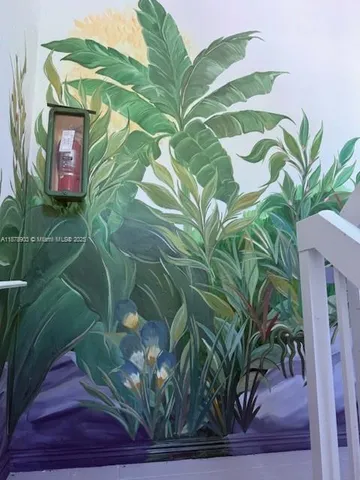 a view of a potted plants next to a wall