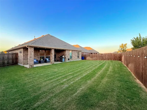 a view of a house with a big yard