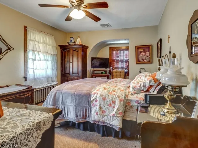 a bed room with a bed and a chandelier