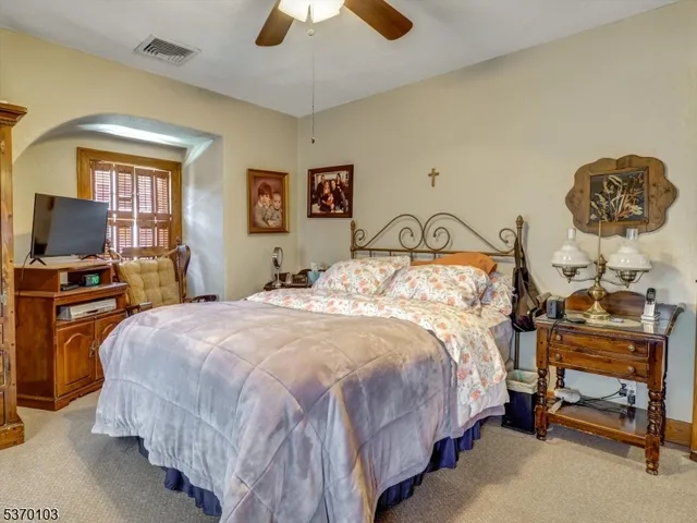 a bedroom with a bed and furniture