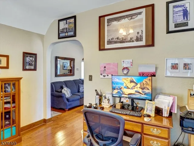 a room with furniture and painting on the wall