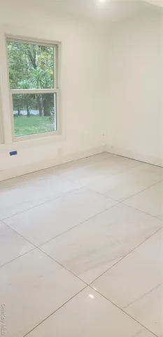 a view of a room that has a window