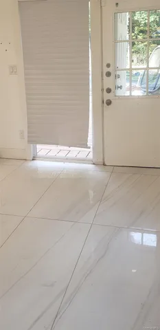 a kitchen with granite countertop a sink and a stove